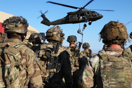 Soldiers assigned to the 1st Battalion, 502nd Infantry Regiment, 2nd Brigade Combat Team, 101st Airborne Division and 3rd Battalion, 501st Aviation Regiment, Combat Aviation Brigade, 1st Armored Division conduct fast rope insertion and extraction training at Mihail Kogălniceanu Airbase in Romania, Nov. 10, 2022. Soldiers continue to reinforce NATO’s eastern flank and reaffirm the commitment to the European continent.