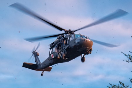 An air crew from the 1-230th Assault Helicopter Battalion of the Tennessee National Guard conducts a casualty hoist exercise as part of the SAREX 23 in Pickett State Park near Jamestown, Tennessee, Jan. 7, 2023. The air crews conducted two hoist practices with other state agencies to be prepared in the event of actual emergency situations in the future. 