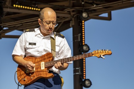 Staff Sgt. Dong Lee, a guitarist assigned to the 3rd Infantry Division Band, performs at Disney Springs, Orlando, Florida, Jan. 9, 2023. This event was one of several performances that the band held throughout the state of Florida.