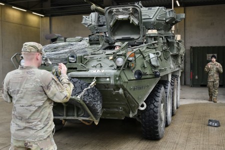 Soldiers assigned to Palehorse Troop, 4th Squadron, 2nd Cavalry Regiment ground-guide a 30 mm Stryker Infantry Carrier Vehicle - Dragoon before a training exercise at Rose Barracks in Vilseck, Germany, Jan. 10, 2023. The regiment provides V Corps with a lethal and agile force capable of rapid deployment throughout the European theater in order to assure allies, deter adversaries and when ordered, defend the NATO alliance. 