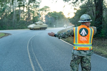 Army Staff Sgt. Gabriel Solano, 341st Transportation Battalion operations hatch foreman, directs Bradley Fighting Vehicles to the Transportation Core Dock Jan. 25, 2023, in North Charleston, South Carolina. More than 60 Bradleys were shipped by U.S. Transportation Command as part of the U.S. military aid package to Ukraine. USTRANSCOM is a combatant command focused on projecting and sustaining military power at a time and place of the nation&#39;s choosing, advancing American interests around the globe.   