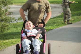 Kansas Soldier Makes Marathon Team Pushing Friend to Finish