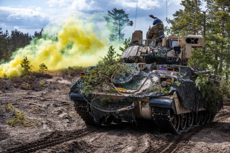 U.S. Soldiers assigned to the 2nd Armored Brigade Combat Team, 1st Cavalry Division supporting the 4th Infantry Division maneuver an M2 Bradley Fighting Vehicle during exercise Arrow 23 in Niinisalo, Finland, May 5, 2023.
